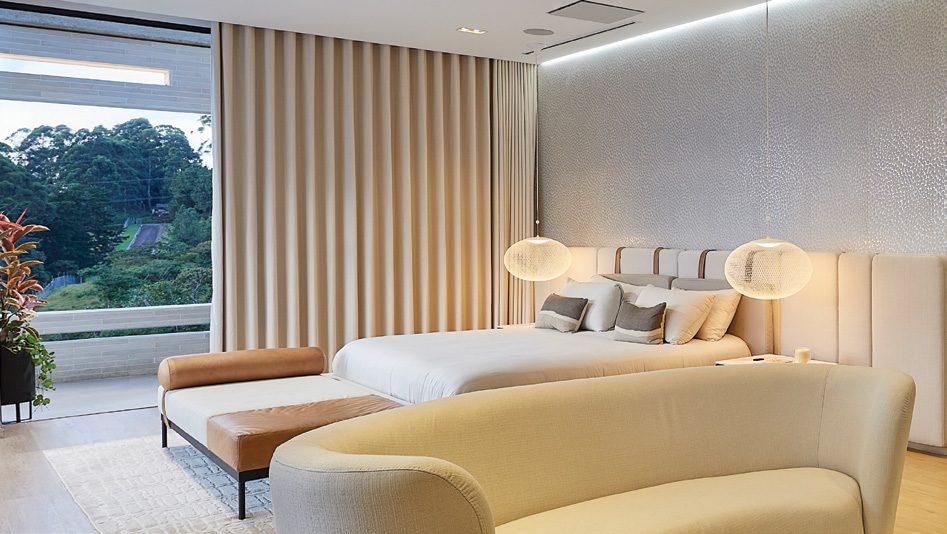 Motorised drapery by Lutron in a furnished room