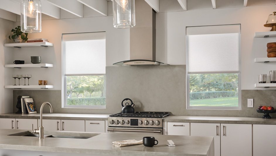 Roller shades by Lutron in a furnished room